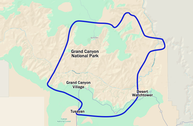 Map showing the Canyon Spirit helicopter tour route marked in blue, departing from Tusayan and flying over the South Rim near Desert Watchtower, across to the North Rim, and back to the starting point
