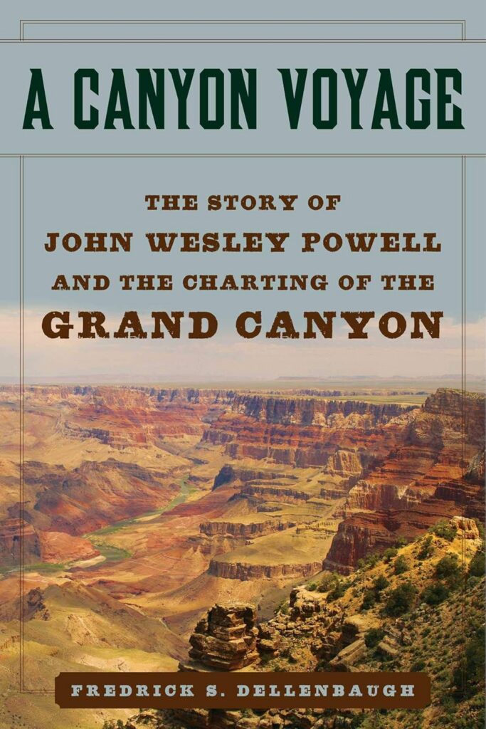 Book cover for "A Canyon Voyage: The Story of John Wesley Powell and the Charting of the Grand Canyon" by Frederick S. Dellenbaugh, featuring an aerial view of the Grand Canyon with layered rock formations and the Colorado River winding through the canyon floor