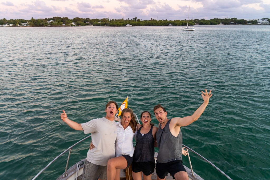 Jen and Elliott with their friends Adam and Kathryn who visited them while they lived on a boat