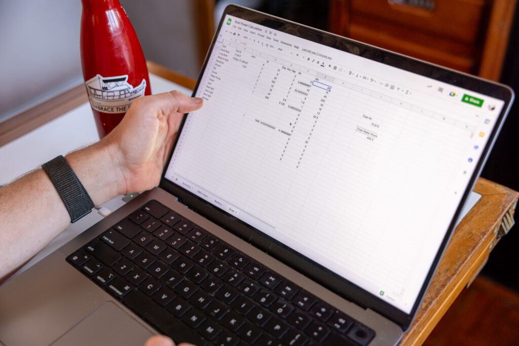 Elliot's laptop with a spreadsheet open in their salon