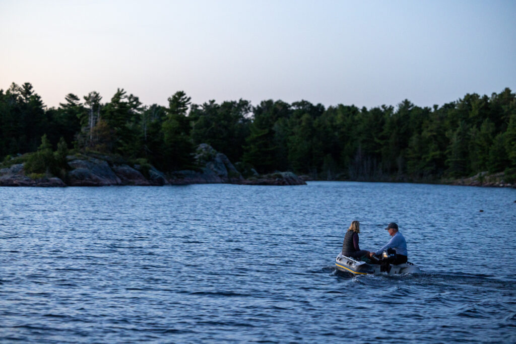 our friends on their dinghy after sunset