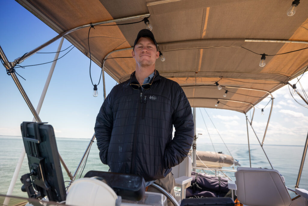 Elliot standing on helm