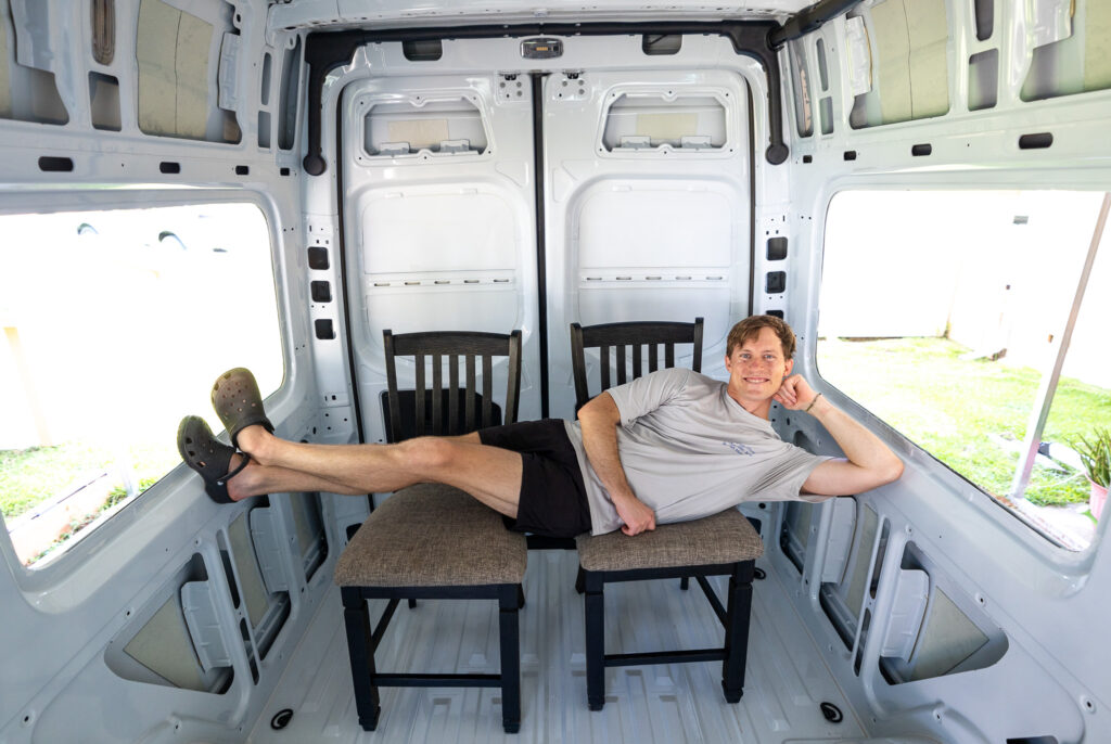 elliot laying where bed could be in the van