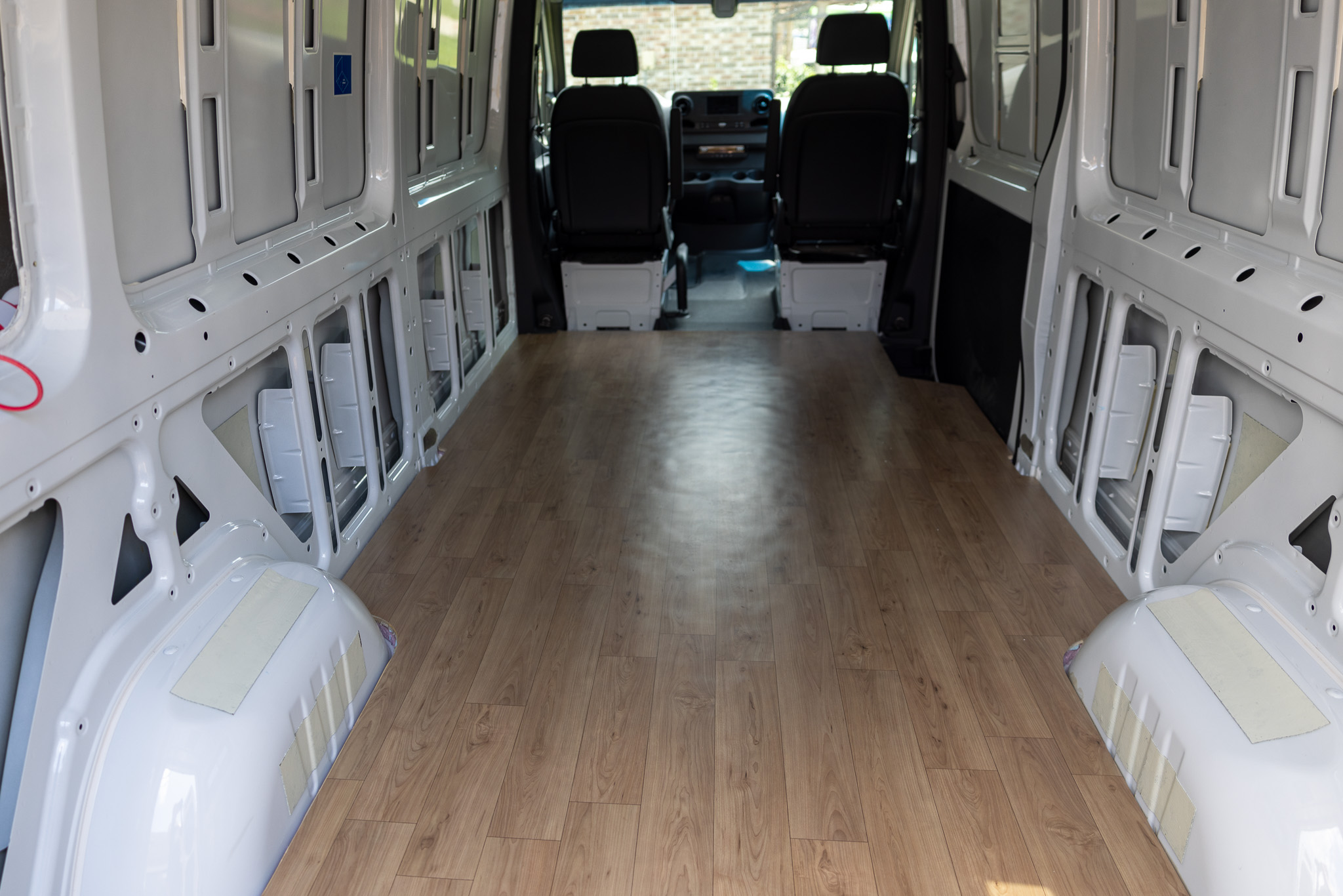 view looking at entire finished camper van floor
